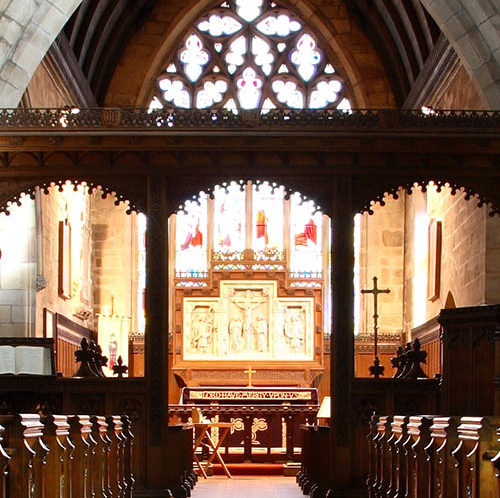 View down church pews to altar
